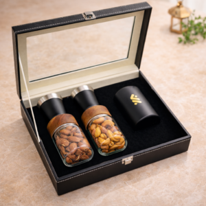 Qahwa Delight Ramadan gift box with almonds cashews and decorative candle UAE